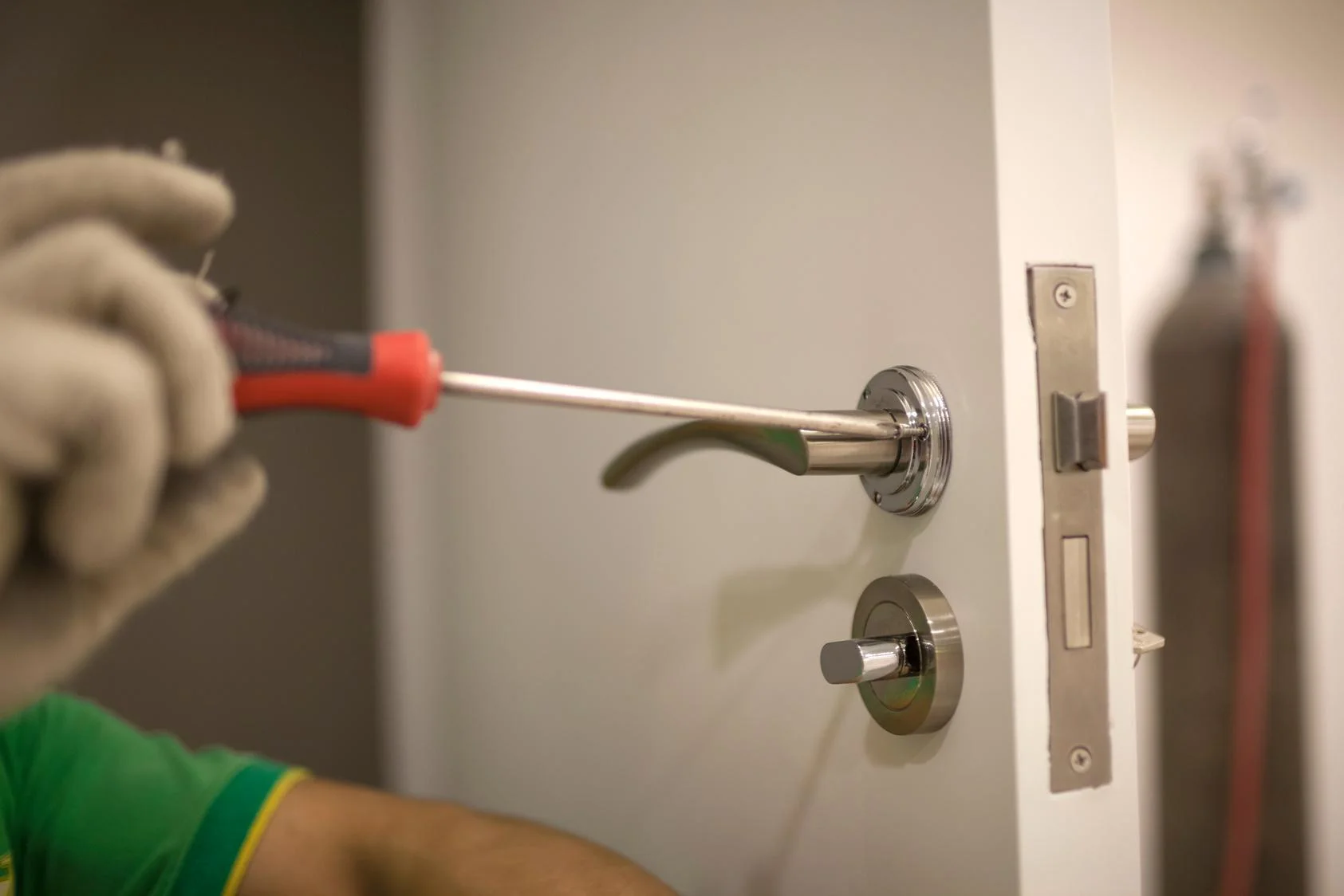 Locksmith Fontana Residential Services man installing lock